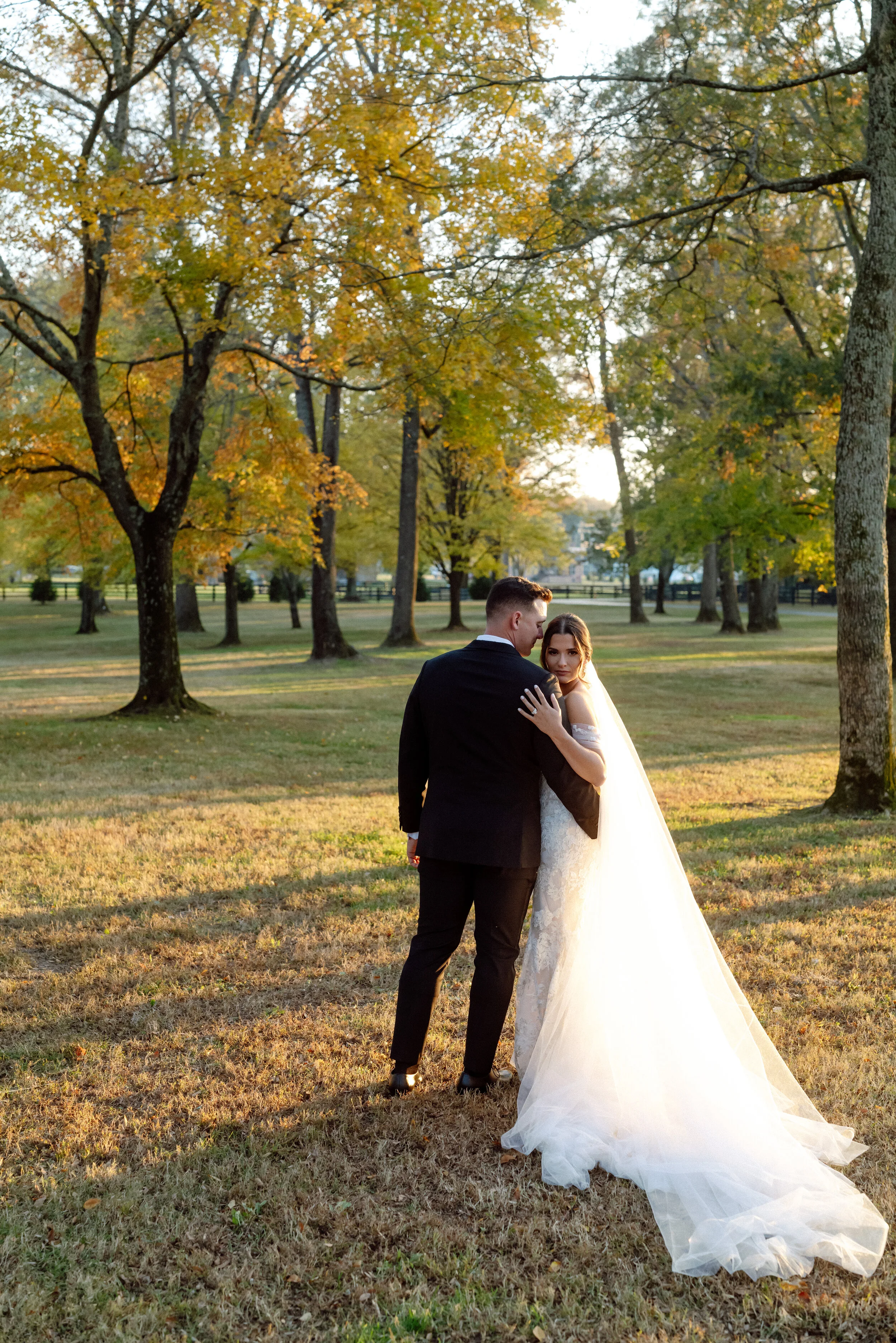 destination-wedding-photographer-couple-embrace-autumn-park.jpg