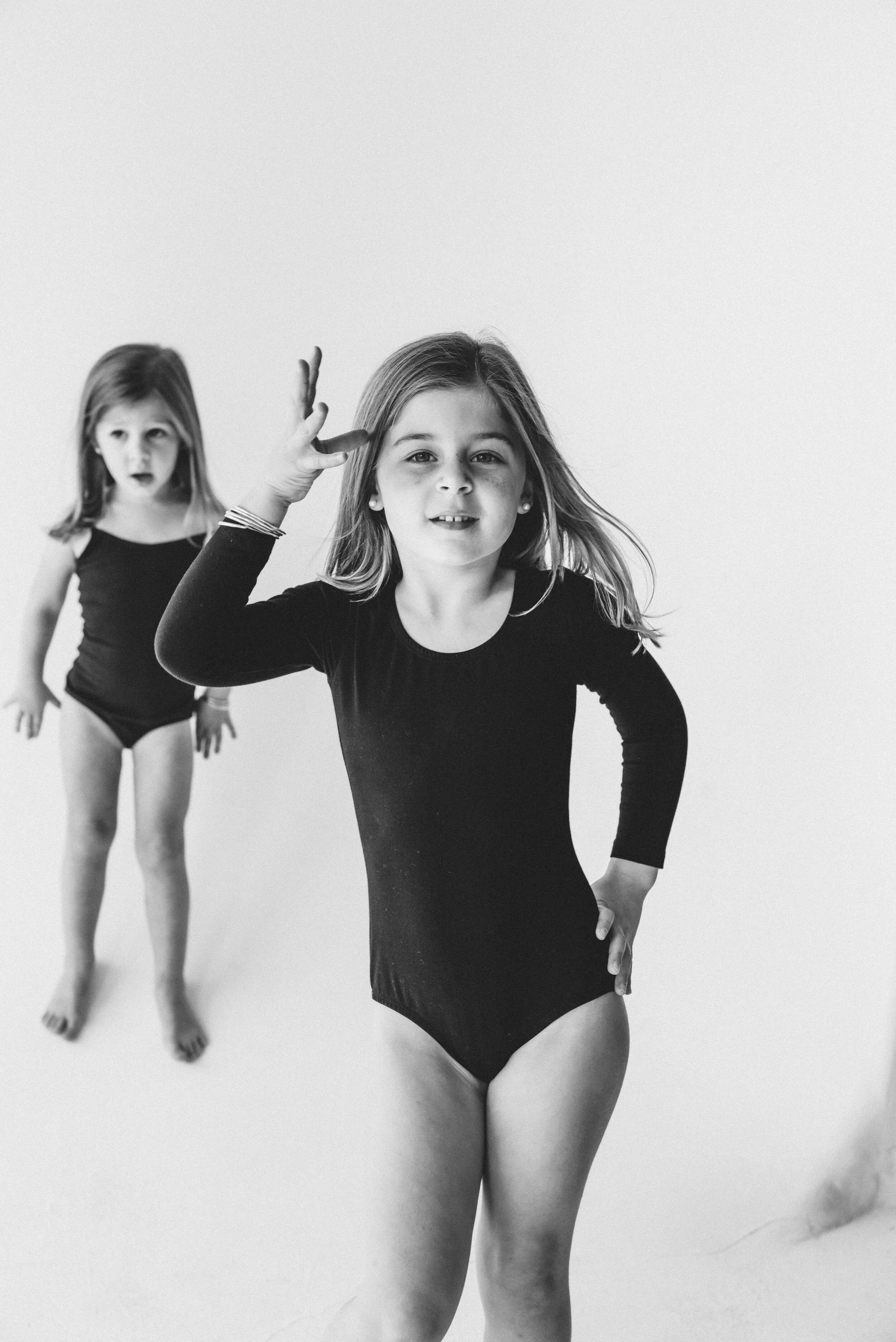 miami-family-photographer-sisters-playful-studio-portrait.jpg