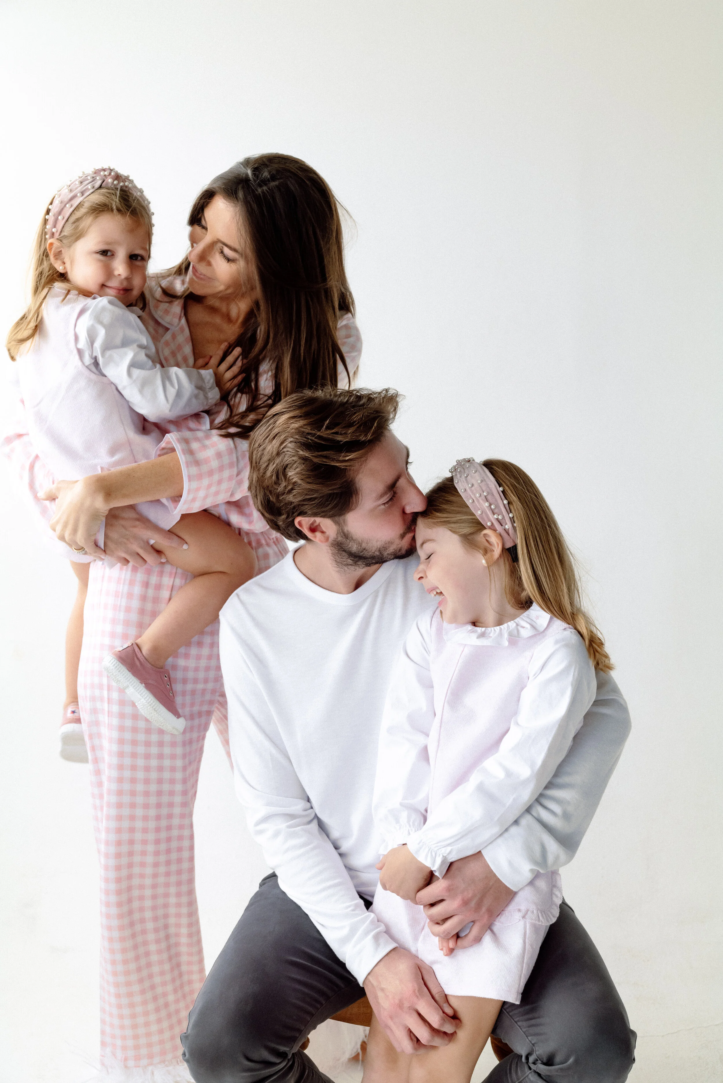 miami-family-photographer-parents-daughters-embrace-portrait.jpg