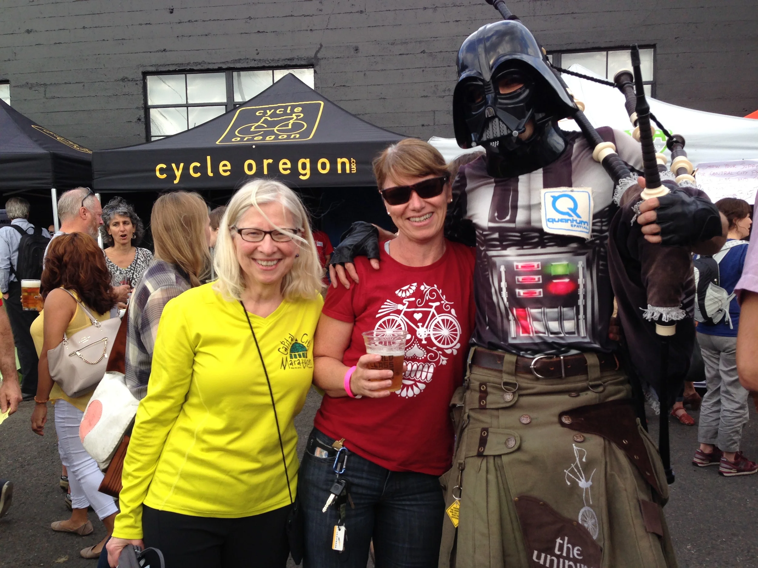Maureen (far left) with Bike More Challenge Team Captain and the infamous Uni-piper at the BTA Challenge After-Party