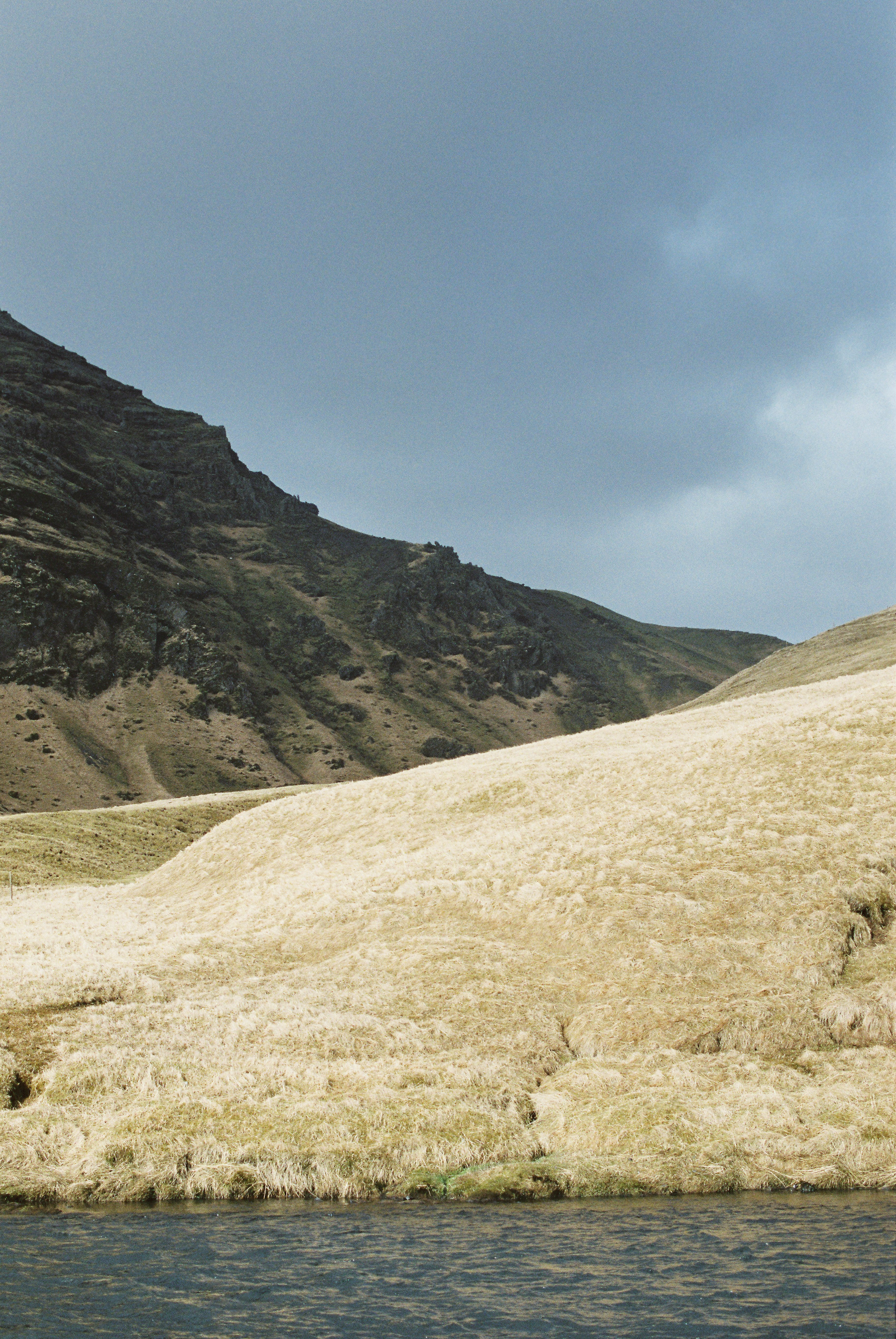 Brandon Sampson Photography. Stormy Hillside Near Skógafoss, Iceland. Film Photography