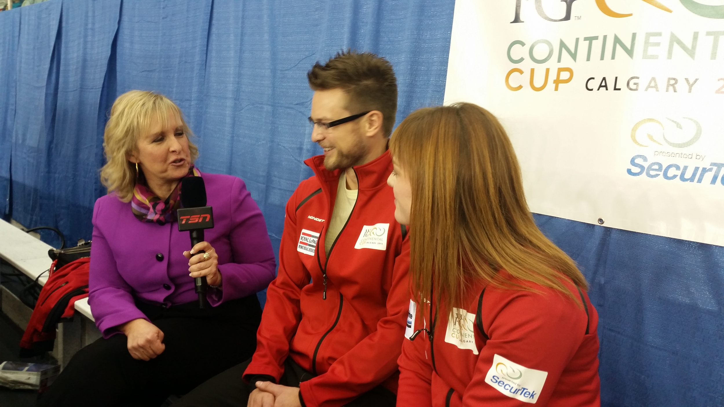 Team lead Dawn McEwen is interviewed by TSN's Cathy Gauthier along with husband Mike McEwen