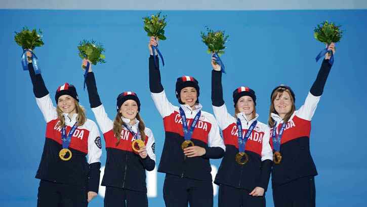 Submitted Photo Jennifer Jones, Kaitlyn Lawes, Jill Officer, Dawn McEwen and Kirsten Wall with their gold medals in Sochi.