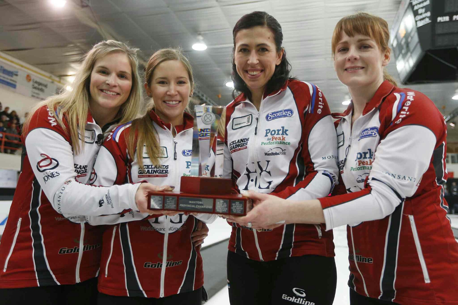 JOHN WOODS / WINNIPEG FREE PRESS Jennifer Jones, Kaitlyn Laews, Jill Officer and Dawn McEwen (from left) celebrate winning the Manitoba title, beating Kerri Einarson Sunday.