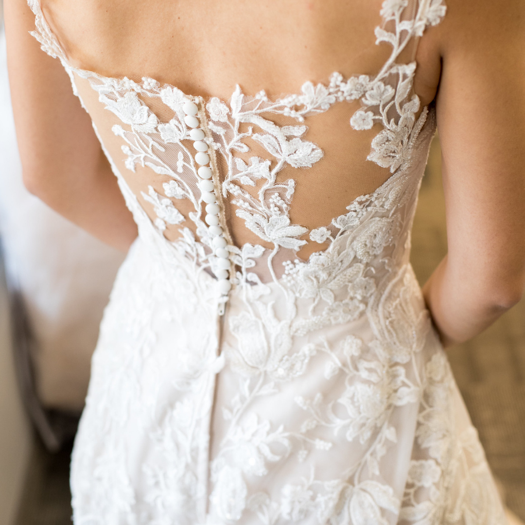 intricate lace back wedding dress.png