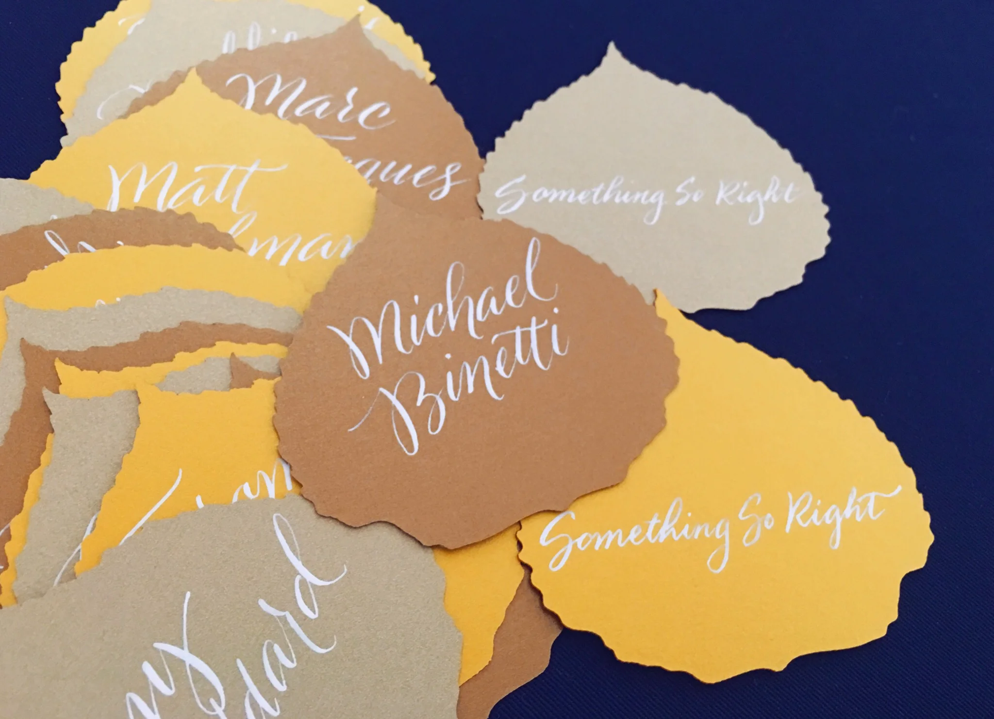 Custom laser-cut aspen leaf place cards for a wedding at The Little Nell in Aspen, Colorado // design and calligraphy by www.chavelli.com