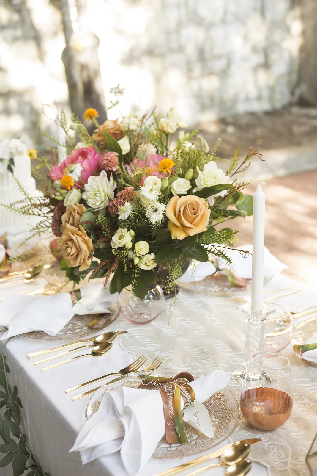 Midsummer Night's Dream inspired wedding shoot // scalloped table runner hand-painted with calligraphy // historic Carolingian calligraphy in rose gold on hand-made paper place card scrolls // hand-painted silk ribbons with calligraphy // paperie and calligraphy by Chavelli www.chavelli.com // photography by Rebecca Jeanson www.rjimagery.com