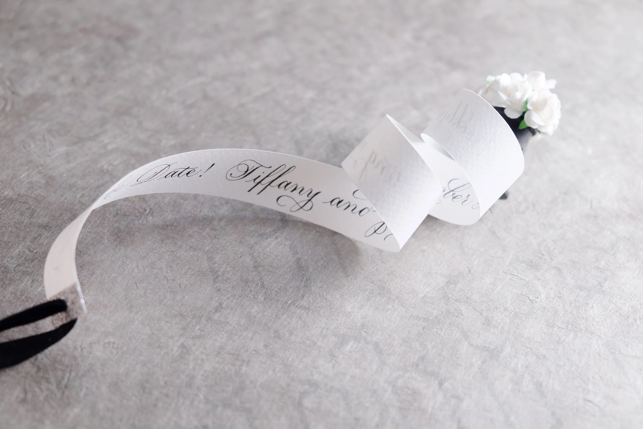 Hand-made scrolls with paper flowers and calligraphy for one-of-a-kind Save the Dates! // designed and hand-crafted by Studio Chavelli www.chavelli.com