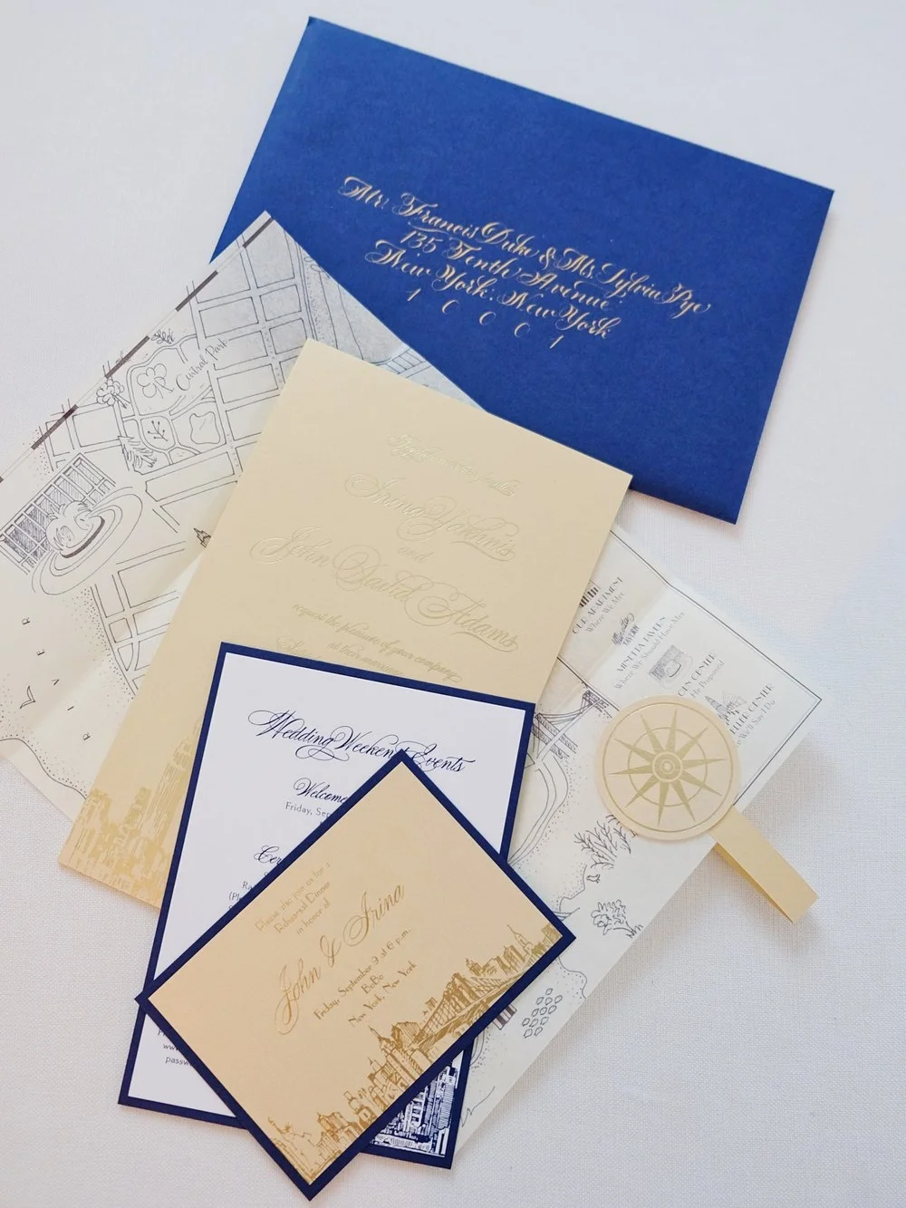 New York City Rainbow Room wedding invitation with gold foil, blue foil, calligraphy, city sketches and a hand-drawn map // design and calligraphy by Chavelli www.chavelli.com