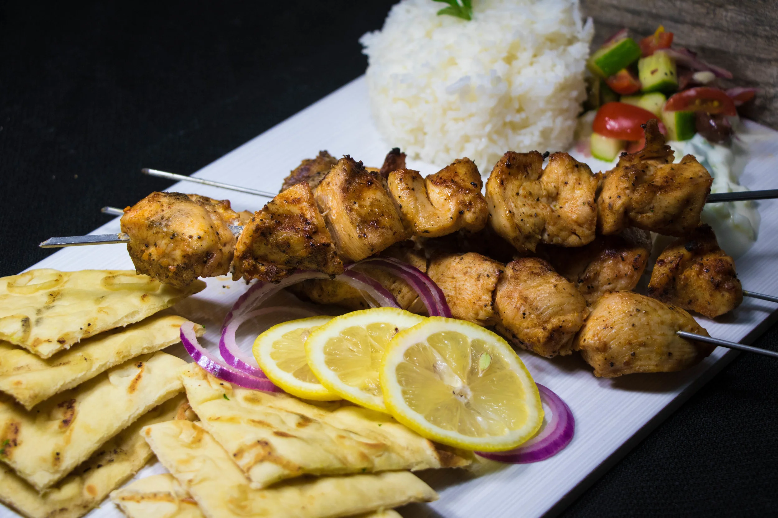 Greek Plate: Marinated Grilled Chicken w/ Rice, Greek Relish, Grilled Pita Bread and Fresh Lemon & Red Onion