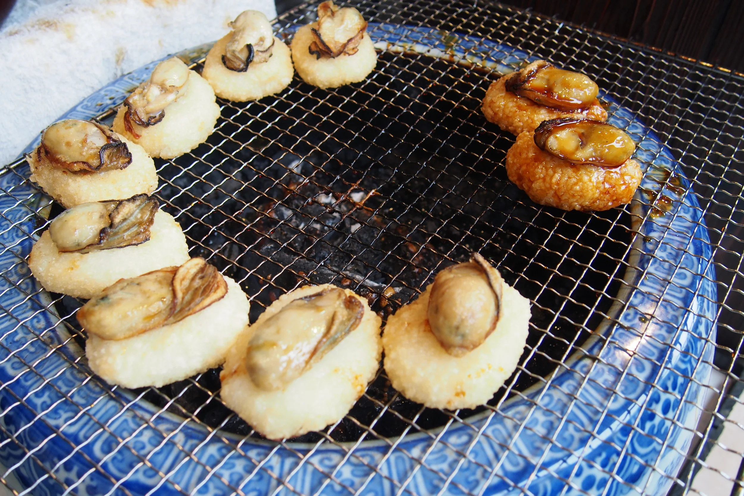 Sauced and not sauced rice balls topped with oyster!