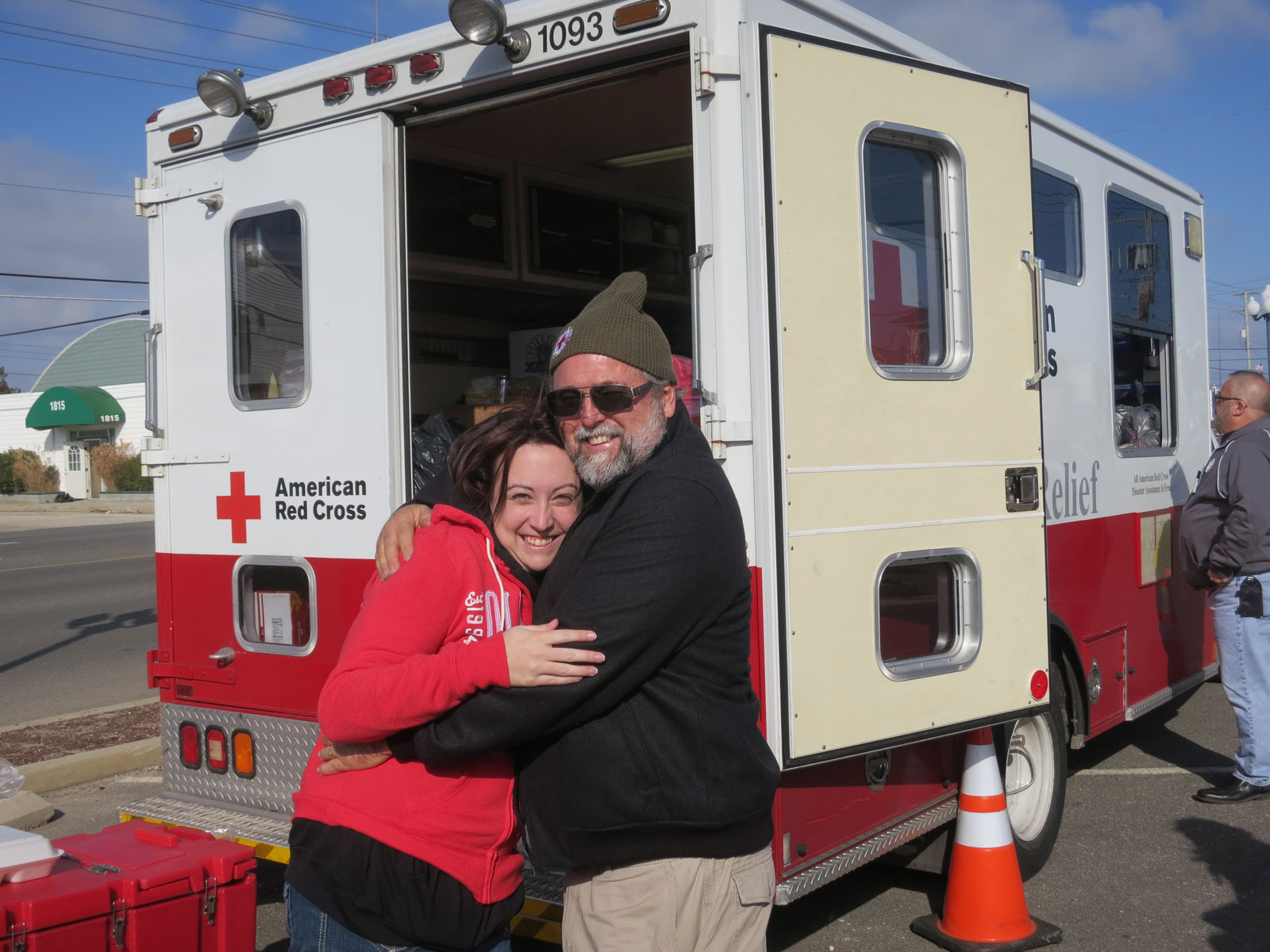 A thankful young woman surprised Dennis with a hug after he offered her a sweatshirt on this cold morning. JC Penny’s and many other businesses donated thousands of coats and sweatshirts.