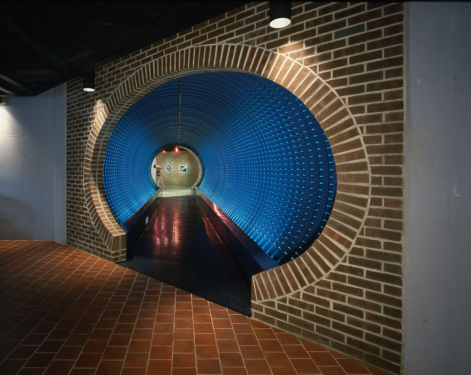 The dramatic entry to the Space Museum was conceived by DKA to transition visitors from daylight and earth to the outer space and the nighttime sky.