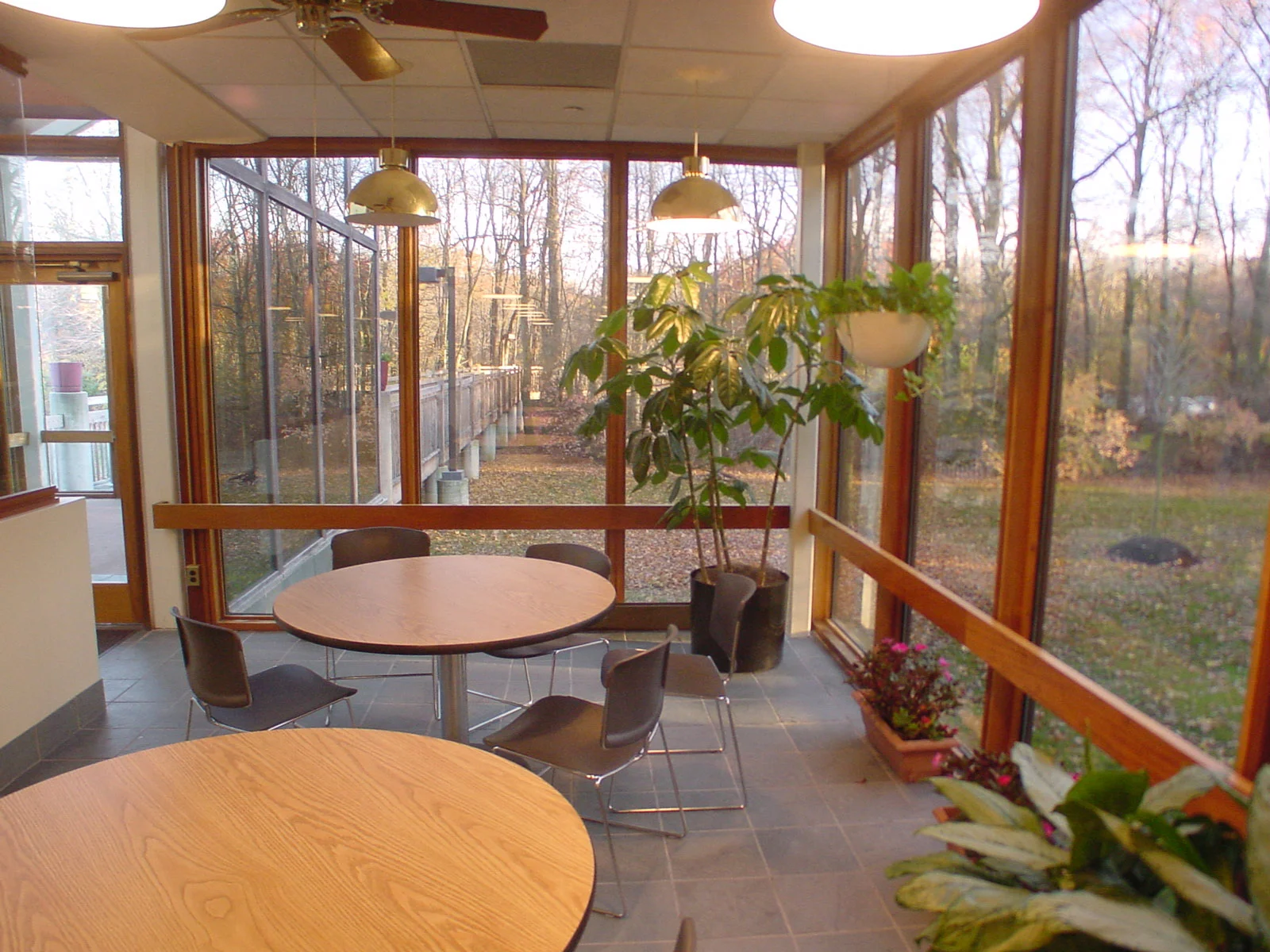 Since many will enjoy the cafeteria, a connection to the beautiful site through full height windows can still be enjoyed by many. Overhangs and the nearby woods itself provide natural shading and sound panels in the ceiling control noise.&…