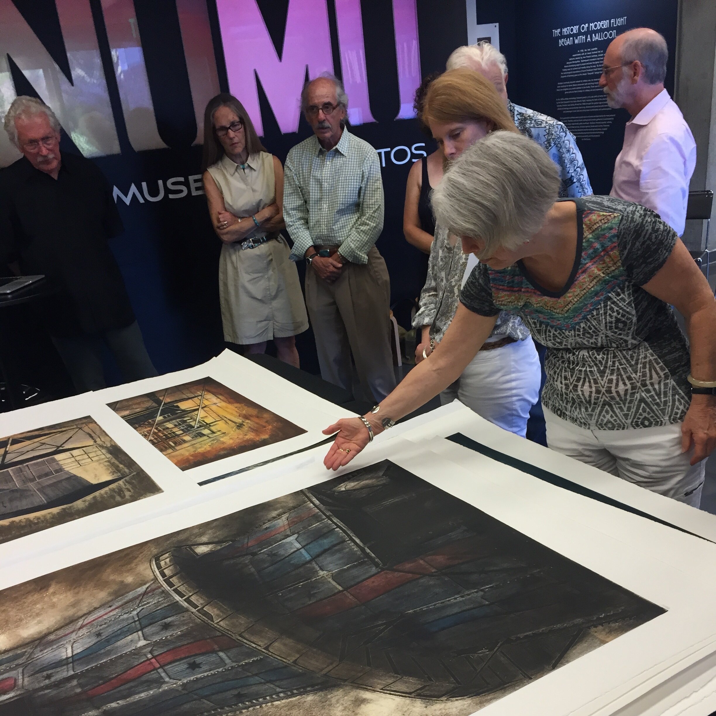 A woman pointing something out in a print (Copy) (Copy)