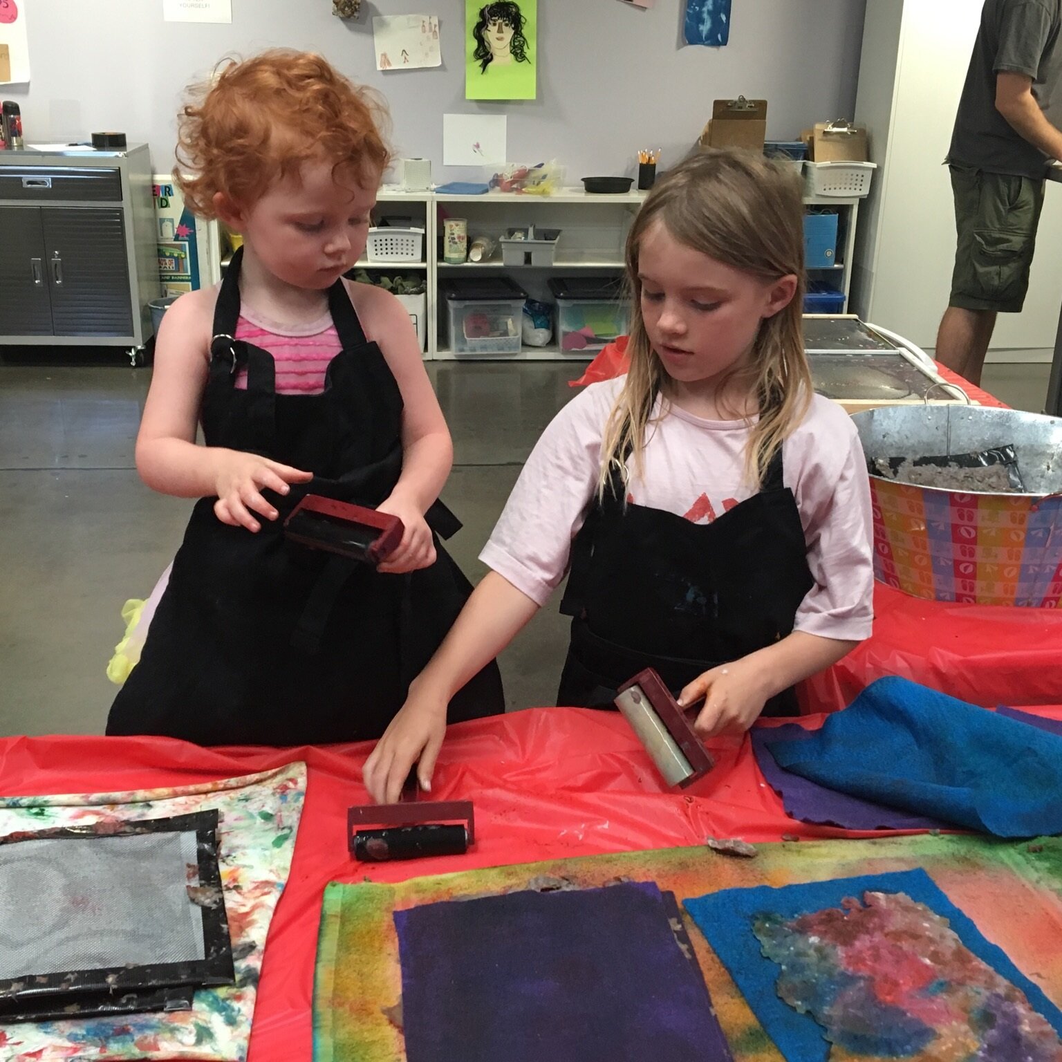 Children participating in print making