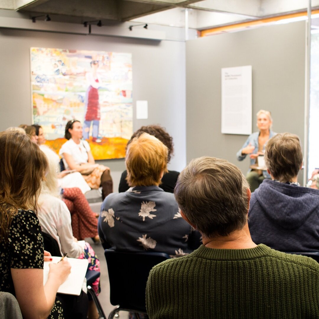 Guests seated, listening to a talk