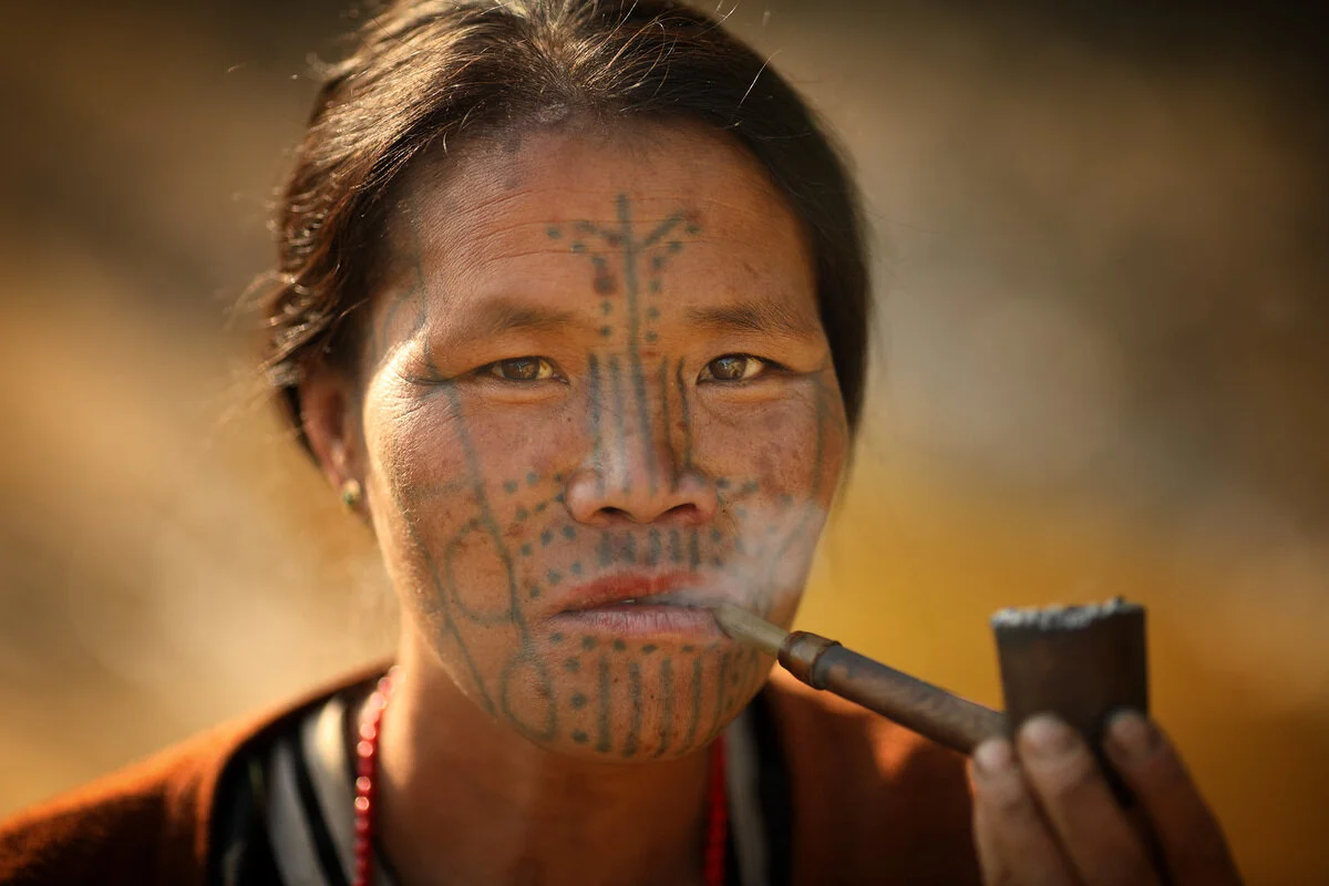 A contemporary Chin woman, with traditional face tattoos.  Courtesy of Atlas of Humanity.