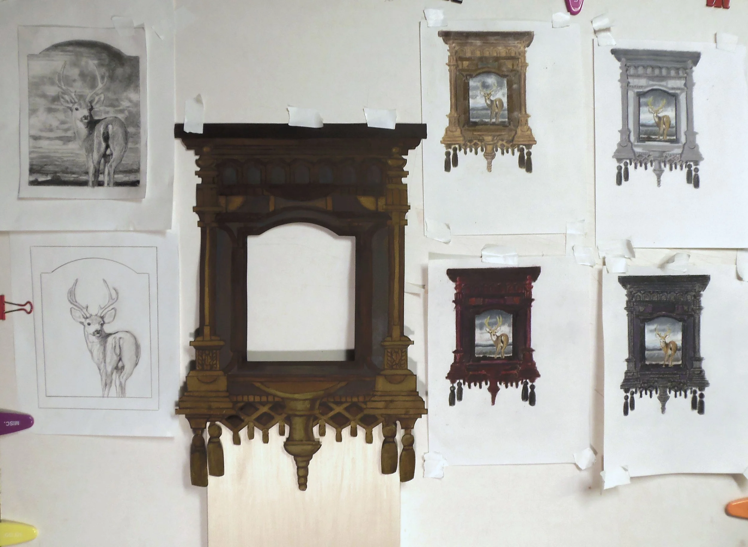 Sketches of a frame and the painting of a deer to go in it hanging on a wall