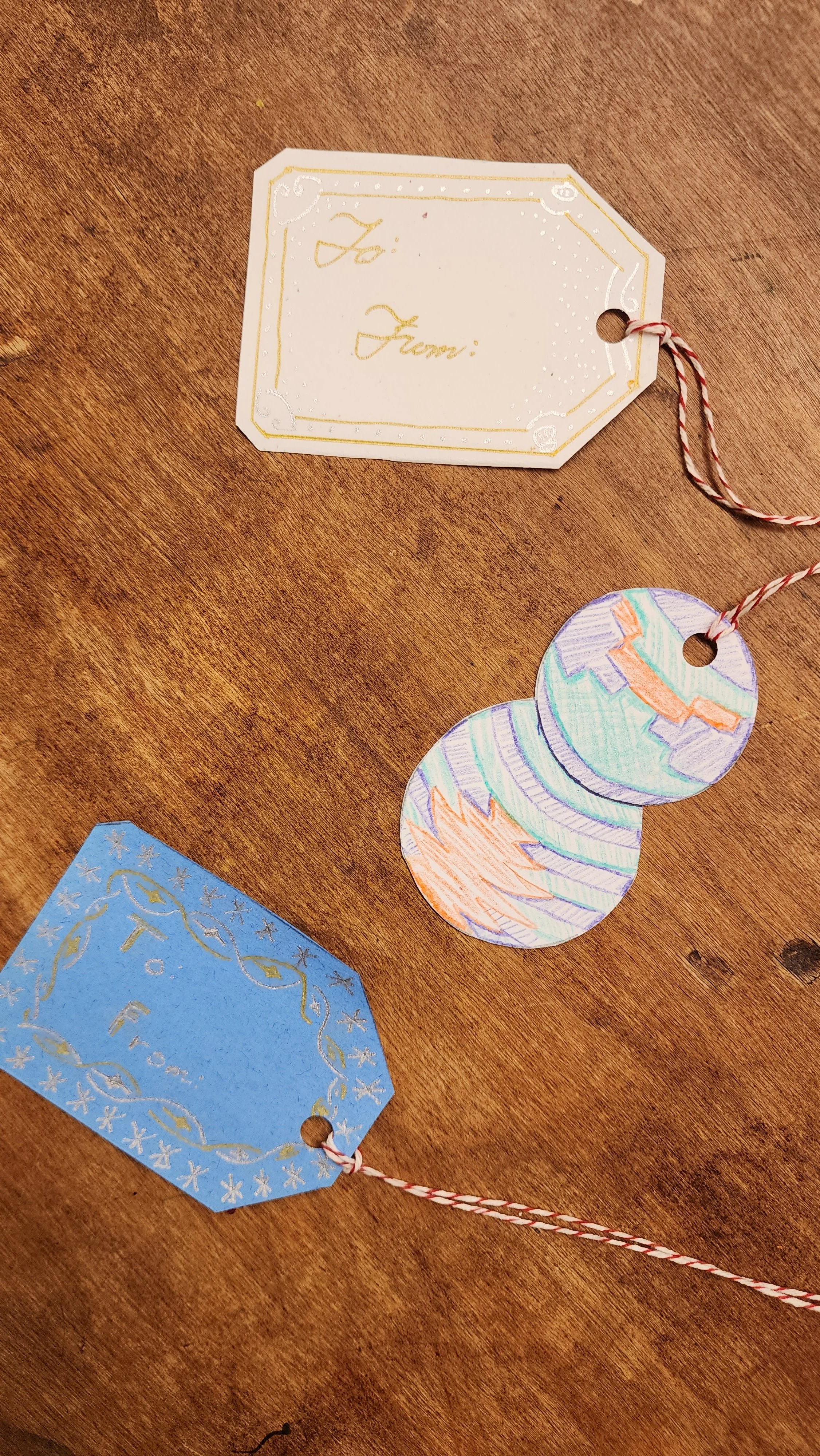 Hand drawn gift tags on a tabletop