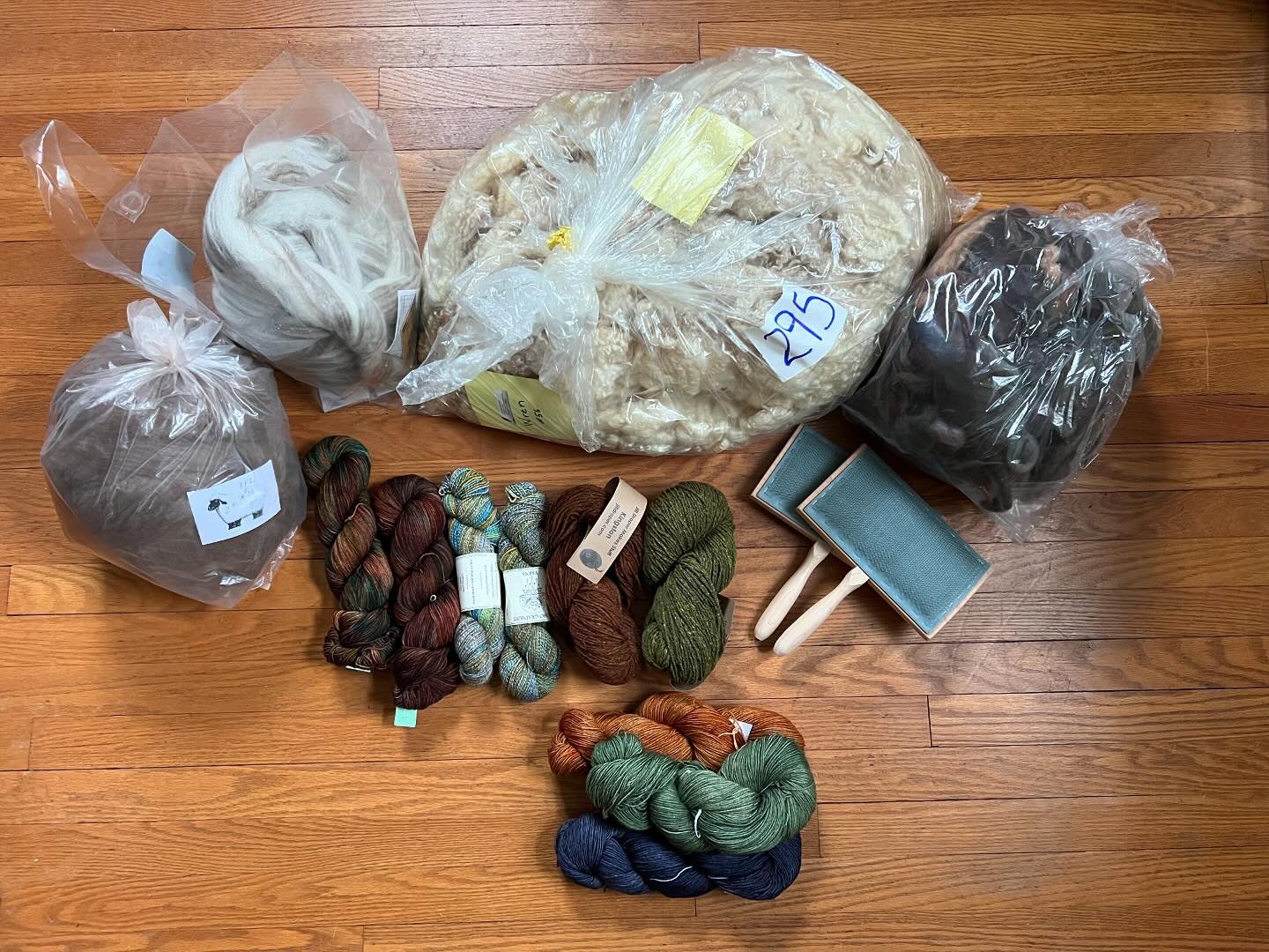 Knitting, spinning, and weaving supplies from the Maryland Sheep &amp; Wool Festival. It was a damp a chilly day, and heaven help me, that big bag is a BFL fleece. What have I done? #jilldrapermakesstuff #imtothewhirled #yarnhygge #bluefieldsfarm #cl