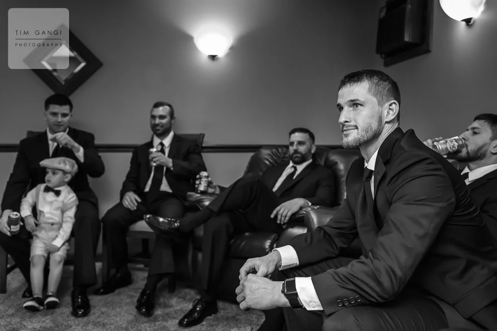 The groomsmen hanging out and kicking back a few cold ones.