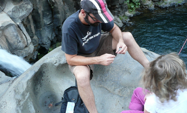 James adjusts the tack on Maddie's pole. The falls are at the left of his elbow.