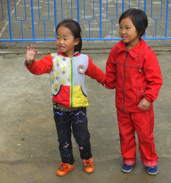 Girls in new clothes at end of harvest at the Chongsan Co-operative Farm in Kangso County, photo by D E