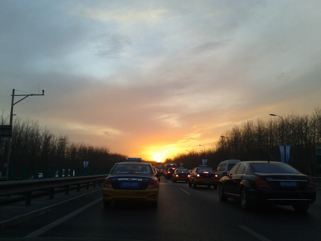 Beijing sunset on the road from Capital Airport.