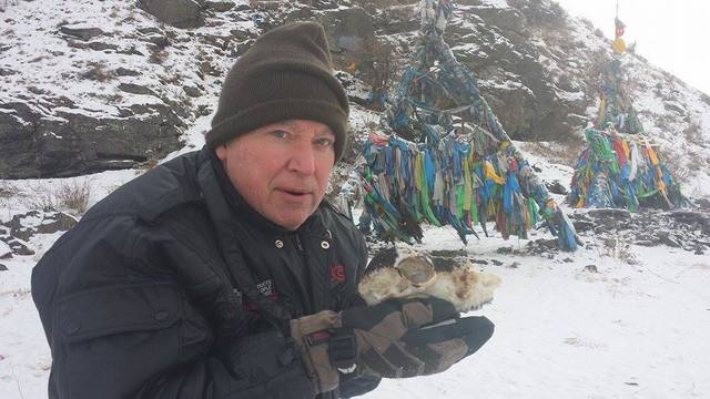 Photo: Don Christian holds a charred sheep skull, an offering discovered on site at an Ovoo (Native Mongolian shaman religion) religious site outside Ulaan Bataar. (c) don christian.