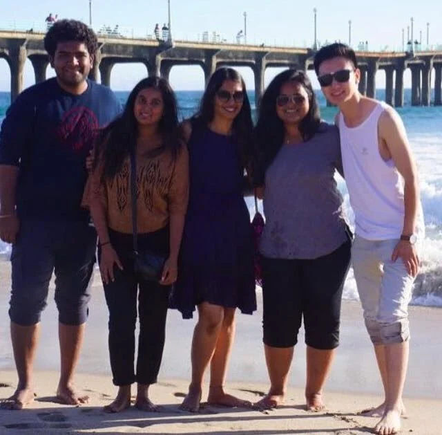Jerry on right with students at the beach.