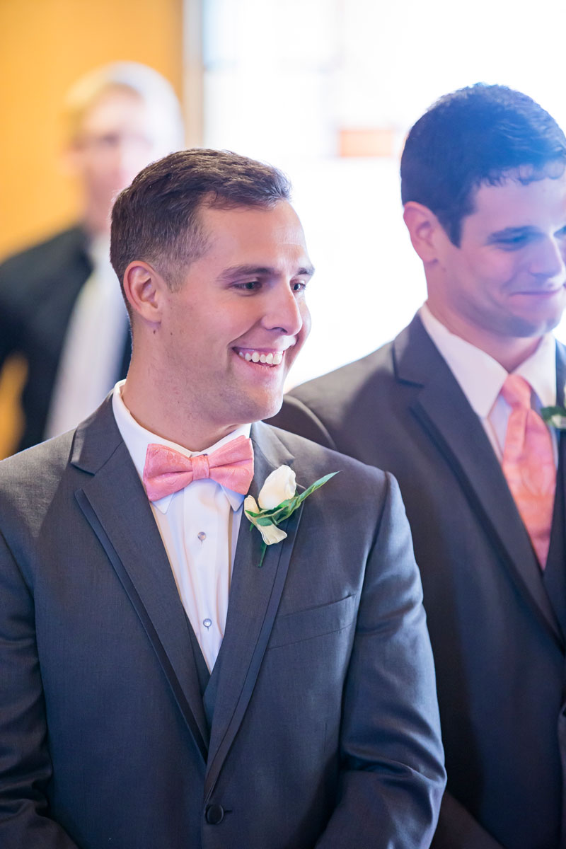 He spotted his beautiful bride making her way to him!