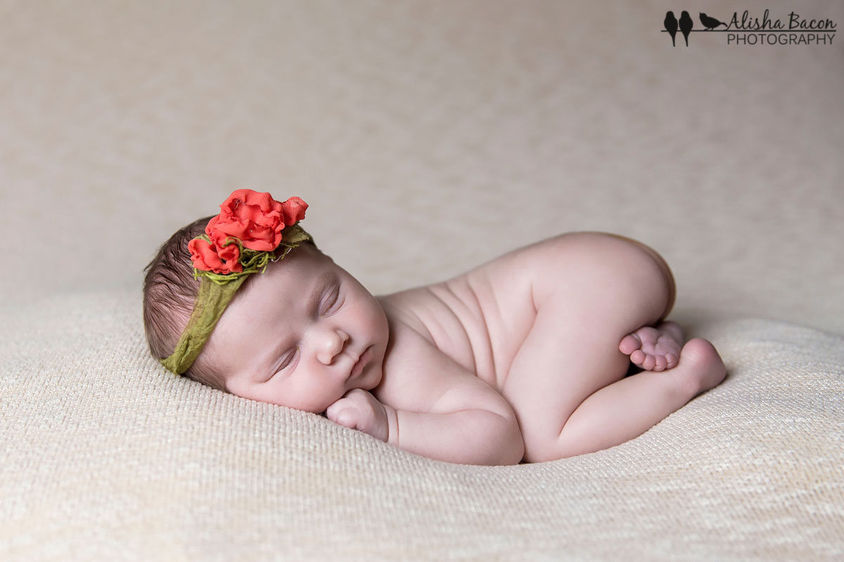Newborn in poppy tieback