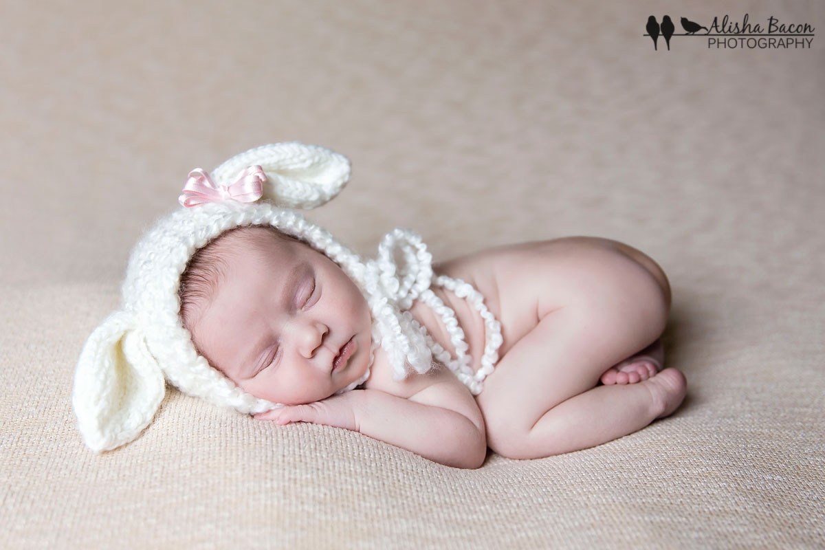 Newborn in lamb bonnet