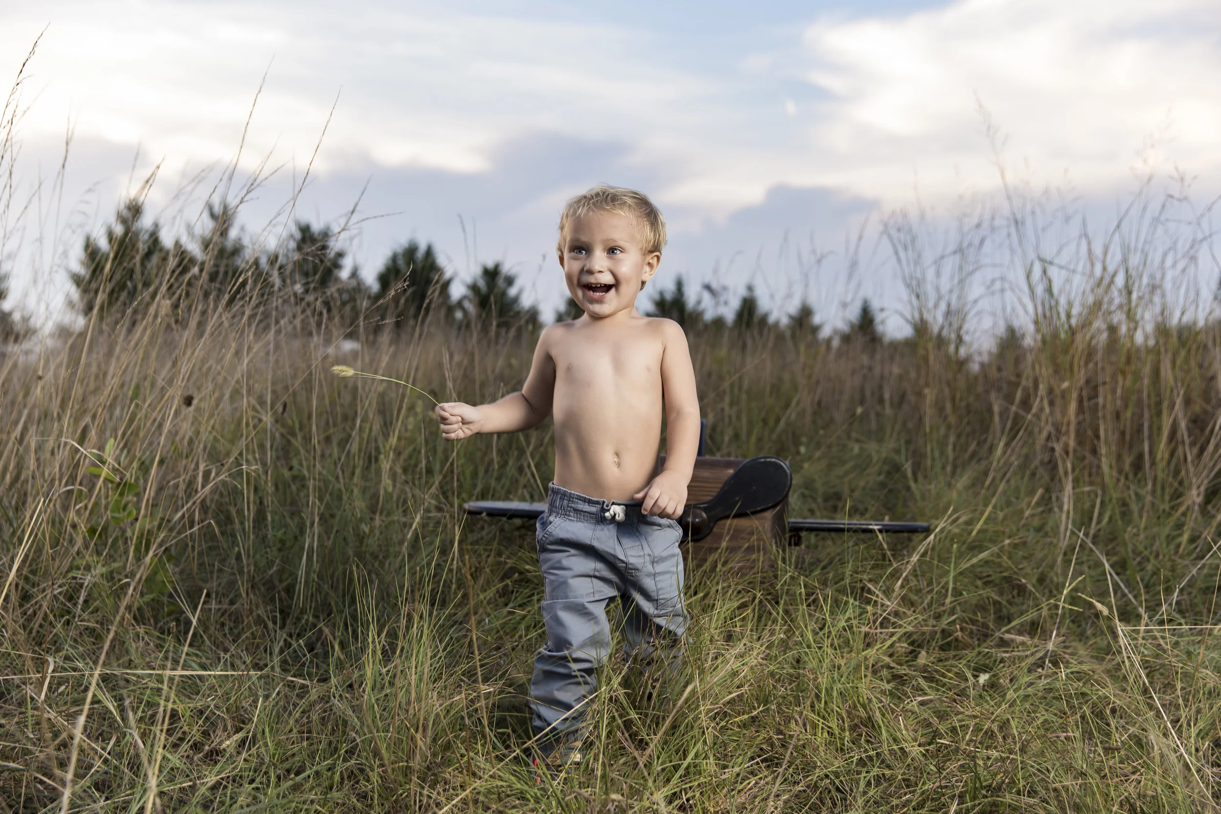 Toddler in grassy field