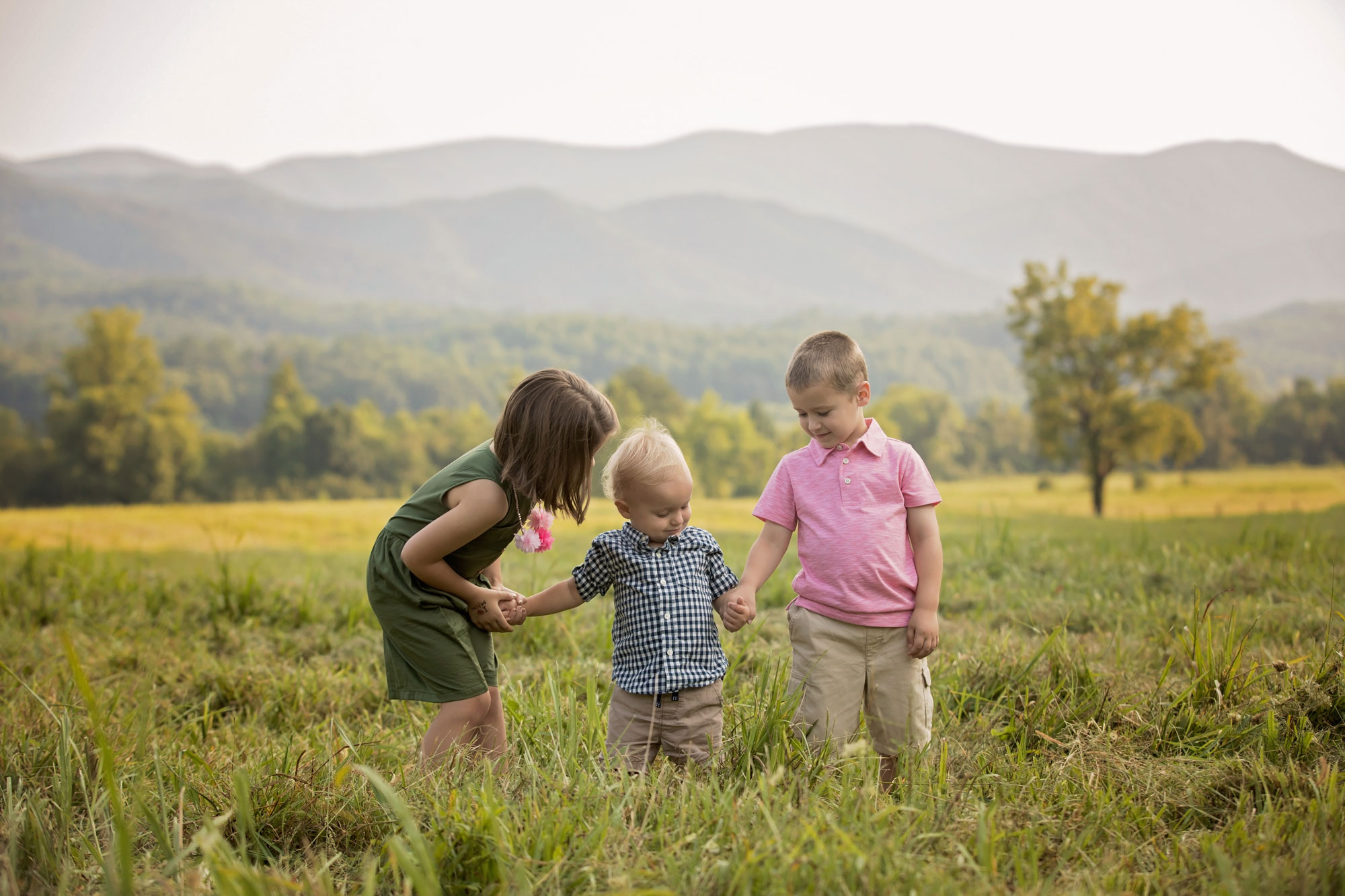 cousins-playing-in-cades-cove-field.jpg