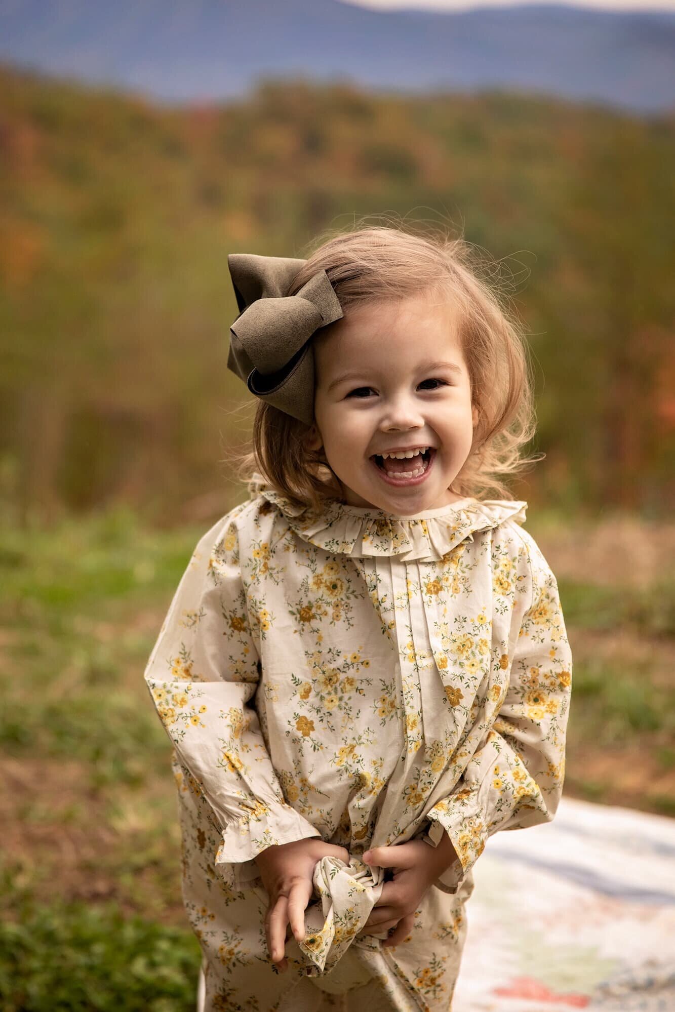 toddler-girl-smiling-gatlinburg-tn-photographer.jpg