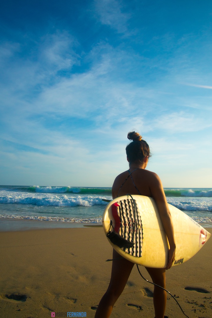 Polly currently lives in Hawaii and travels around the world, whenever school allows it, to surf big waves.