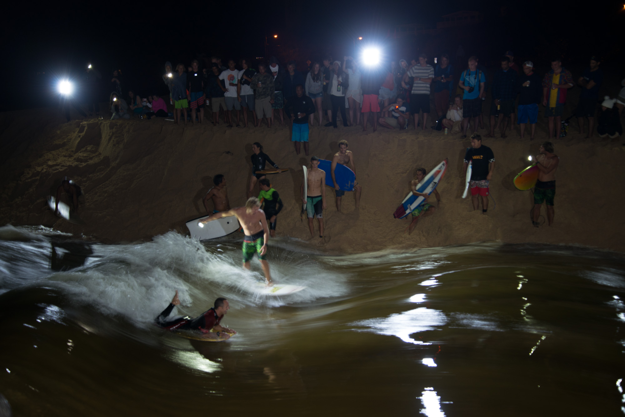 Everyone works to open the Waimea river so it can flow towards the ocean allowing it get bigger and bigger through the night till it carries enough water to let everyone play on it, either on a boogie board or a surfboard. 