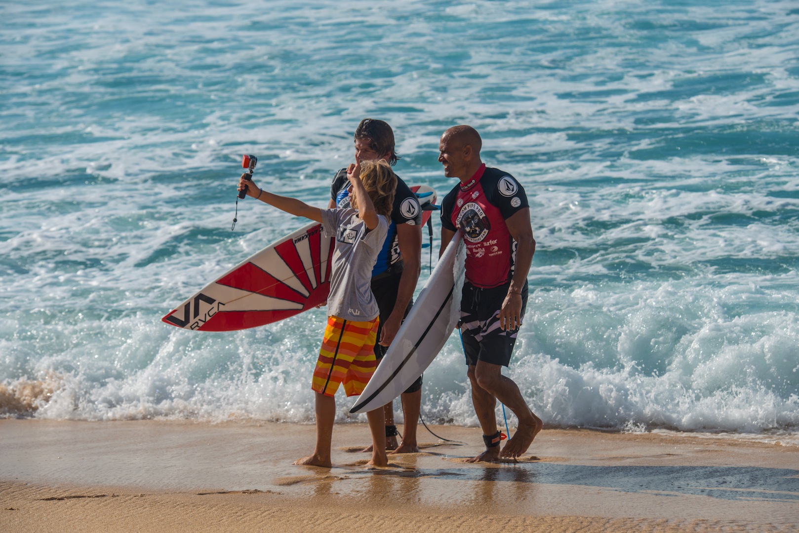 This lucky kid Getting a selfie with Kelly Slater and Bruce Irons after the final.