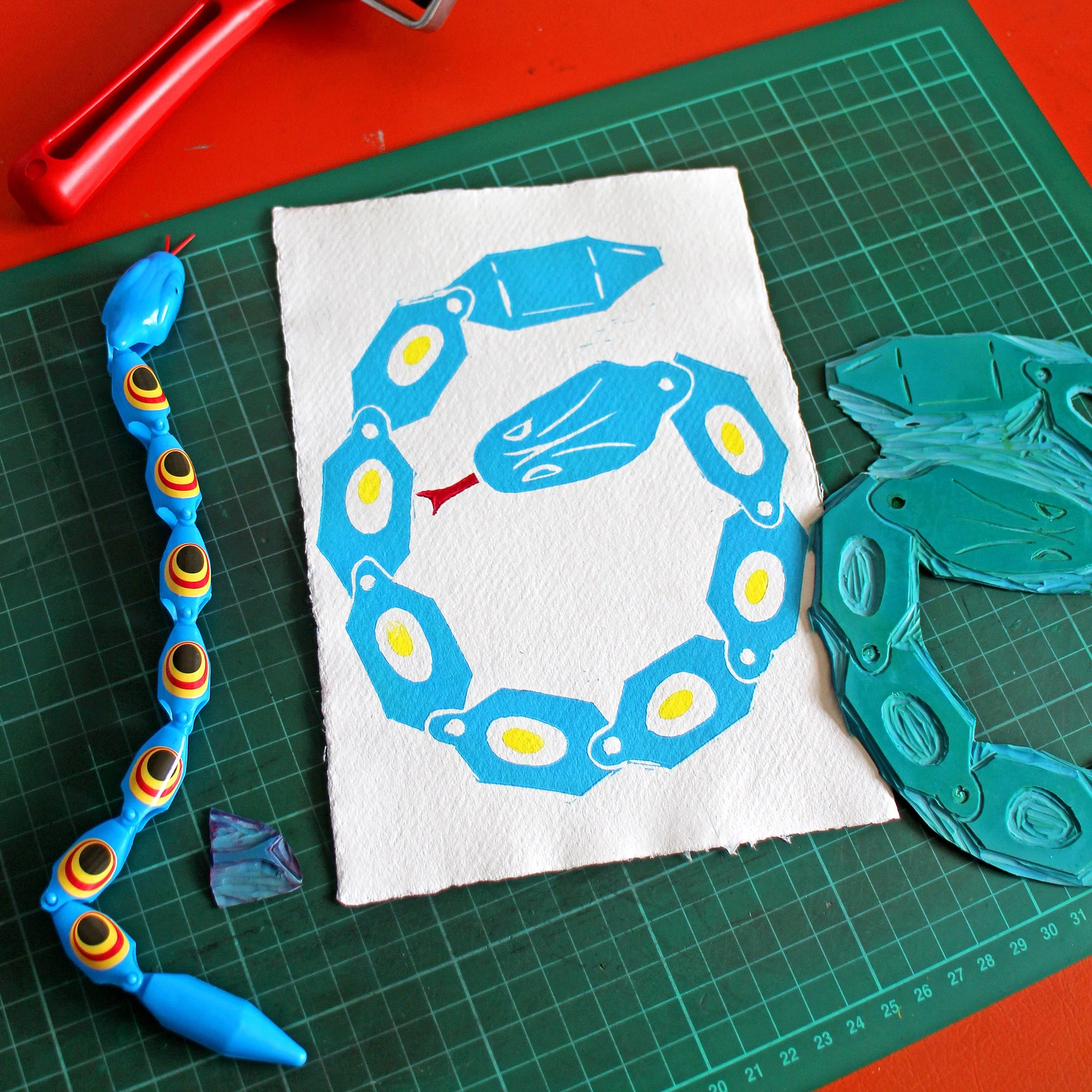 Snake Toy Blue Lino Desk Square 2.jpg