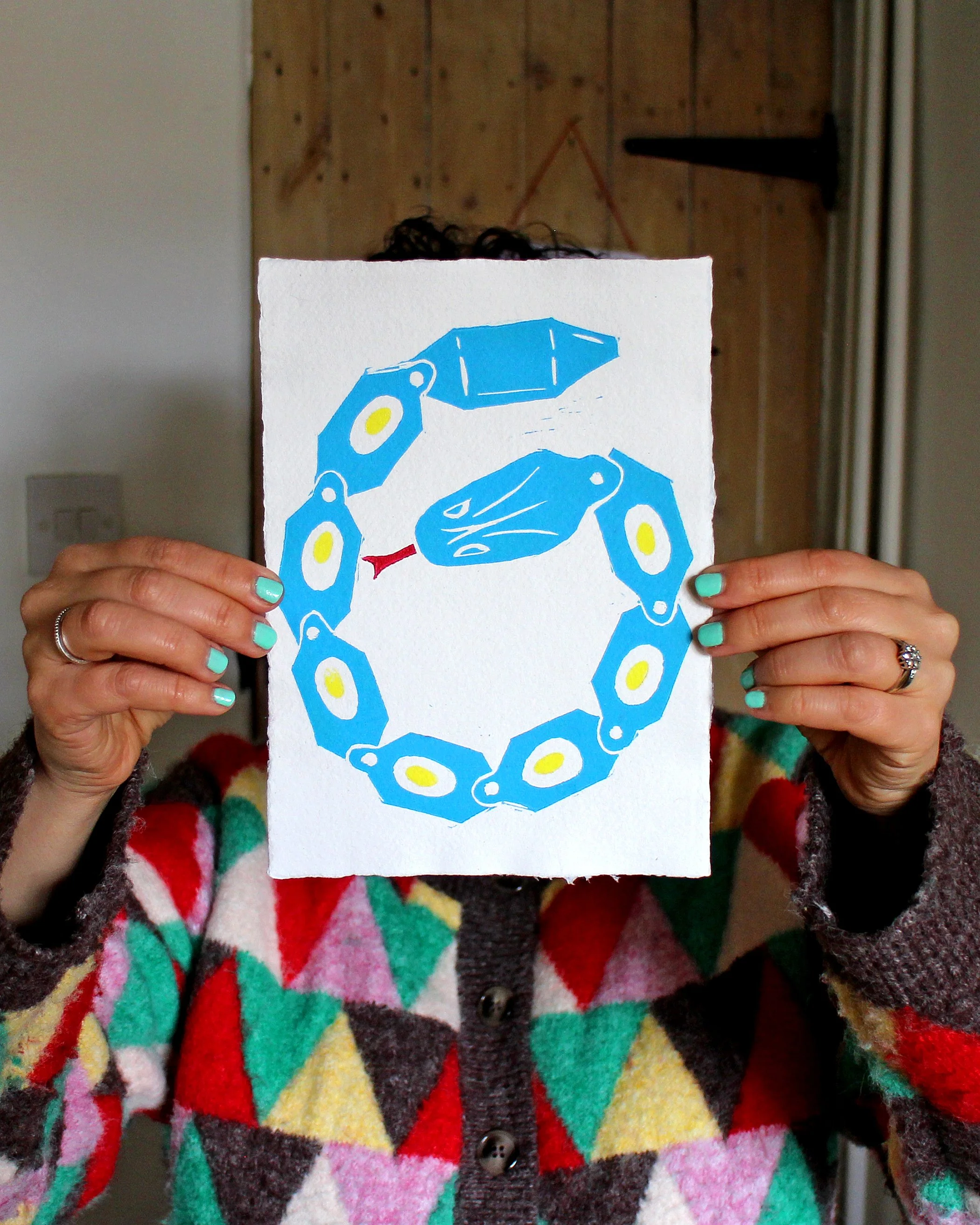 Snake Toy Blue Lino Hold.jpg