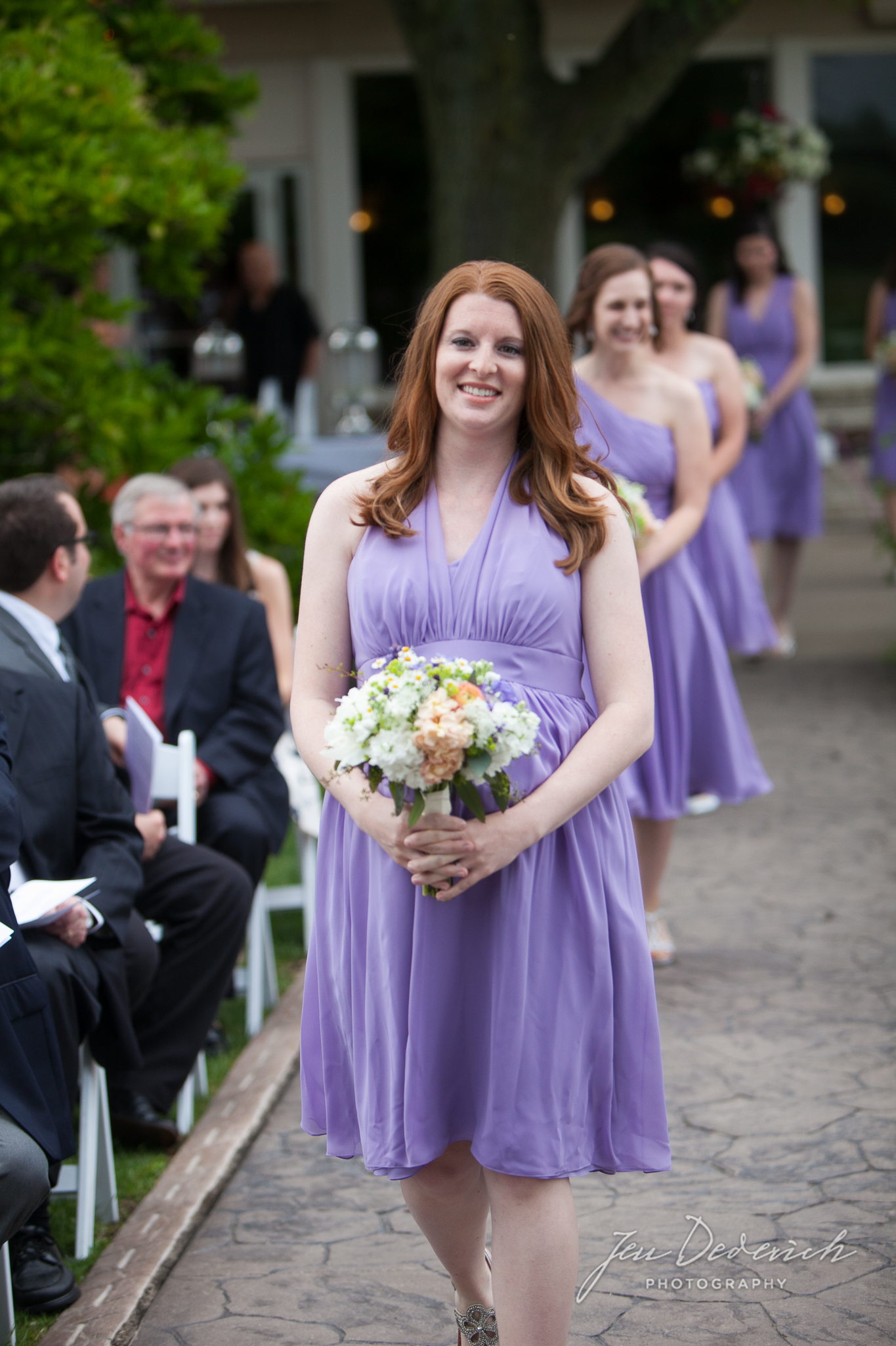 wedding ceremony purple bridesmaids