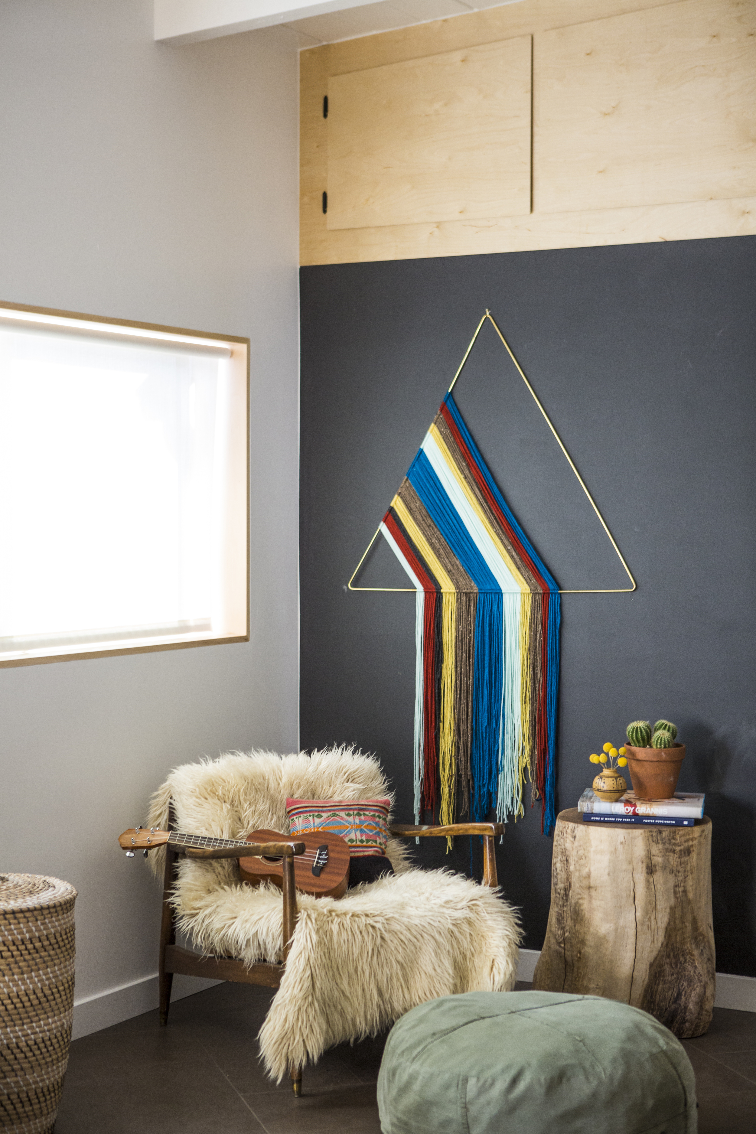 Brass Triangle + Custom Cabinetry + Wood Stump | Photo: Laure Joliet