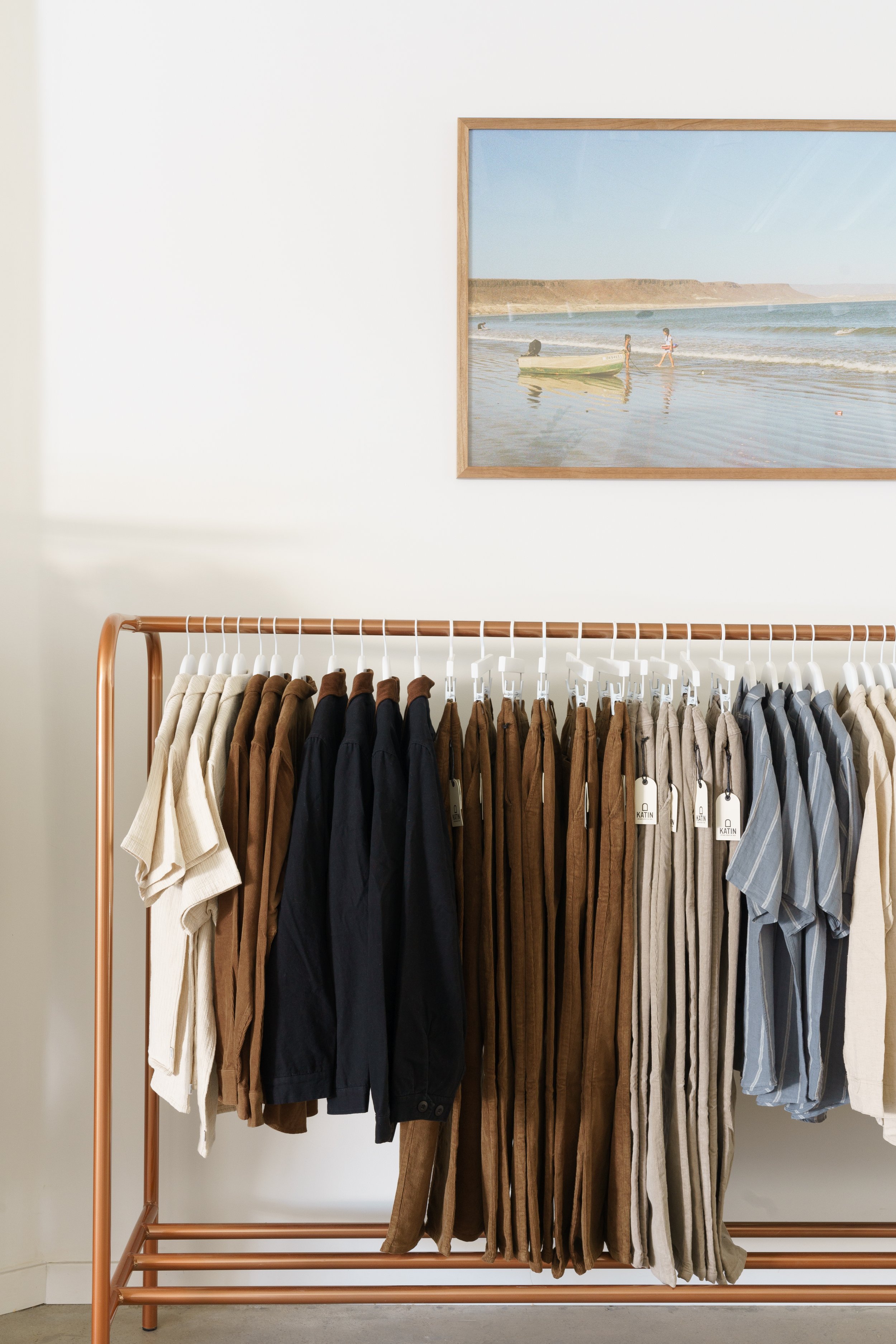 Custom Metal Display Rack With Copper Powder Coat | Hermosa Surf | Solstice Interiors | Photo: Charlotte Lea