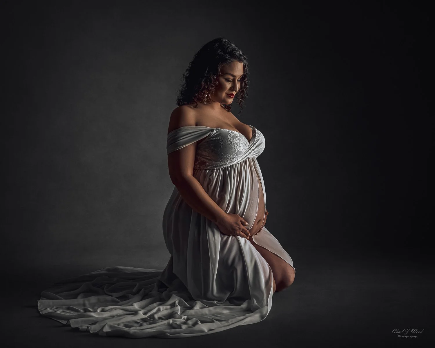 Expectant mother in ethereal gown for fine art maternity photography