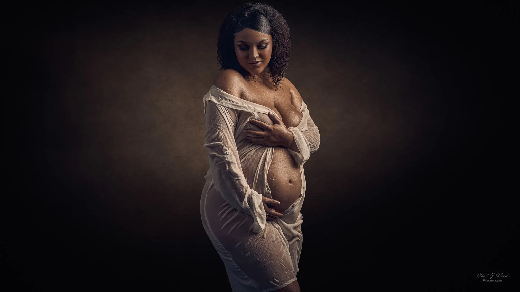 Mesa Maternity Photographer Near Me: Studio portrait of a pregnant woman in a maternity wet look
