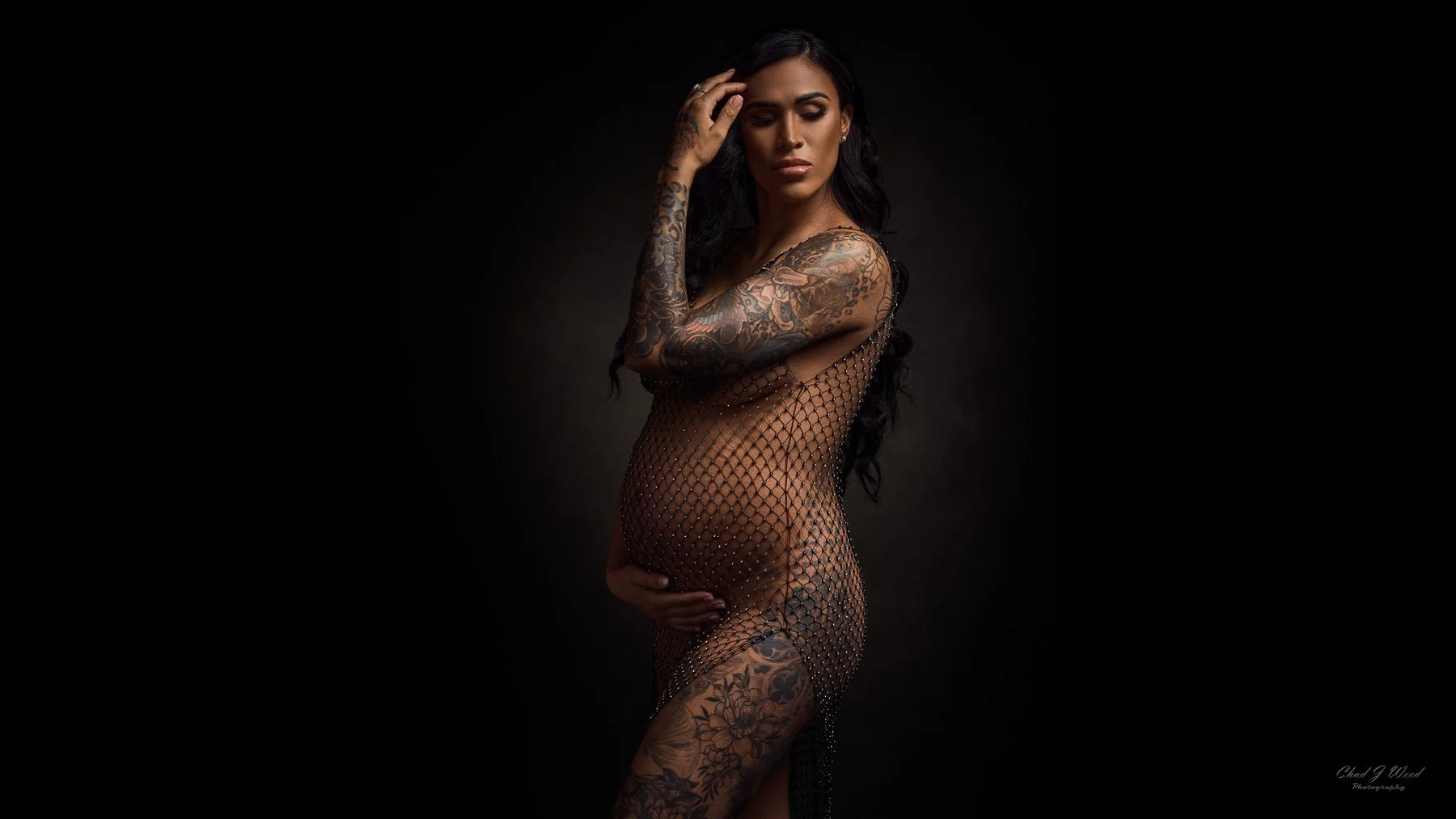 Sensual Maternity Photography: Pregnant woman in delicate lingerie for sensual maternity photo