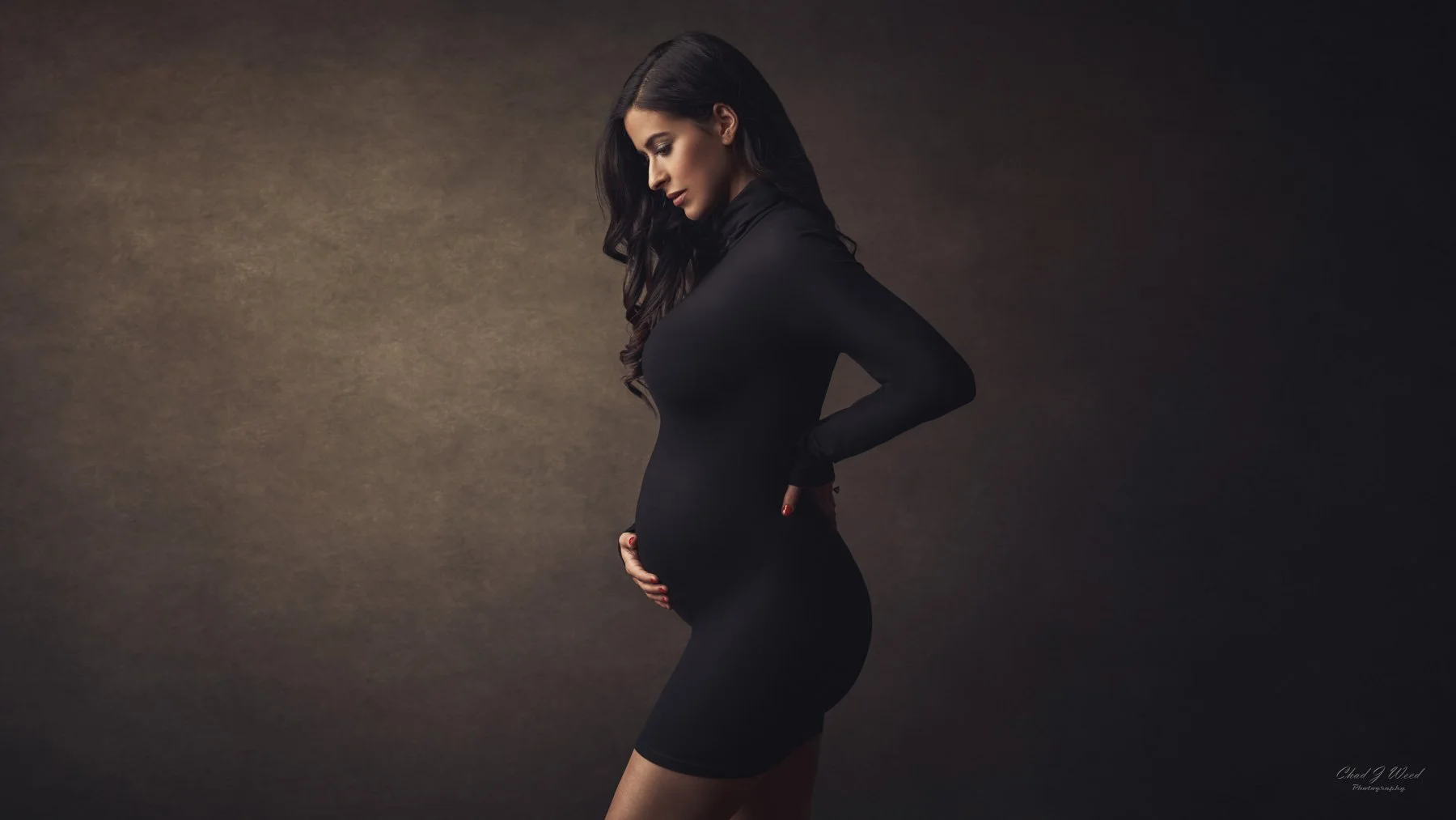 Phoenix maternity photoshoot of little black dress in classic side-profile