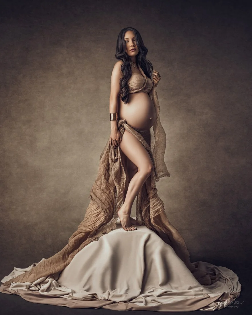 Pregnant woman in sculptural pose for fine art maternity photoshoot